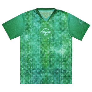 Introducing the Unisex Green Matrix Dot UPF50+ V-Neck MTB Jersey. Made from 100% recycled polyester, this lightweight and breathable jersey keeps you cool and dry. Its two-way stretch fabric offers unrestricted movement, and UPF50+ protection shields you from UV rays. Designed for style and performance, it features a double-layered v-neck collar. Note: Runs small, order one size up. Elevate your ride with the Green Matrix Dot MTB Jersey. Shop now at CrankStyle.com!