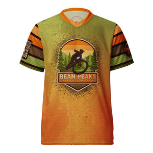 Unisex Bean Peaks PMBA FUNDRAISER &nbsp;V-Neck MTB UPF50+ Jersey  Support the Bean Peaks Gravity Flow Trails in Prescott, AZ, with the Crank Style Bean Peaks Fundraiser PMBA V-Neck MTB Jersey. All proceeds go to PMBA for the Bean Peaks phase two development. This jersey is designed for both men and women and is perfect for mountain biking, hiking, running, and other outdoor activities.